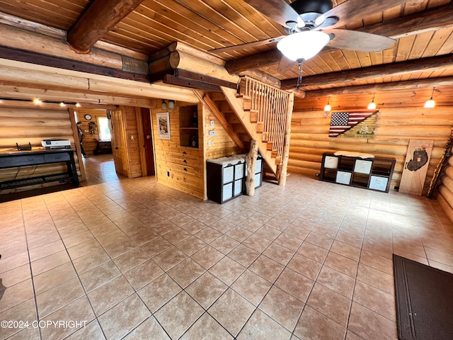 interior space featuring beam ceiling, tile patterned flooring, and wood ceiling