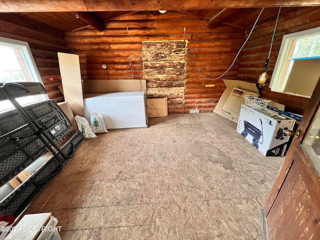 unfurnished living room with lofted ceiling