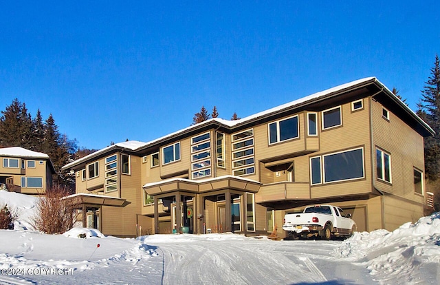 928 Quiet Creek Dr, Homer, AK 99603 - snow covered building featuring an attached garage