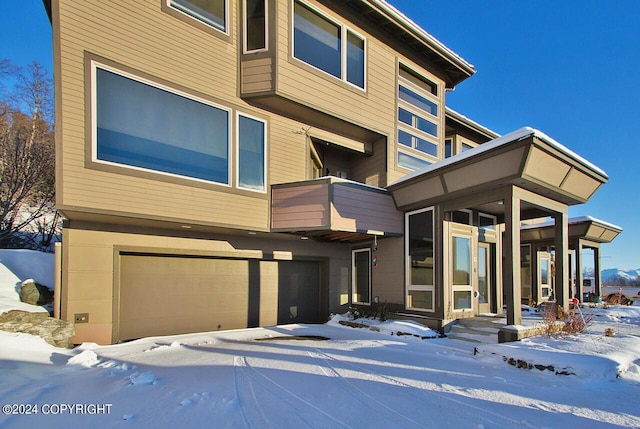 928 Quiet Creek Dr, Homer, AK 99603 - contemporary home with an attached garage and a balcony