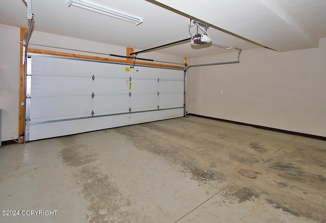928 Quiet Creek Dr, Homer, AK 99603 - garage featuring a garage door opener