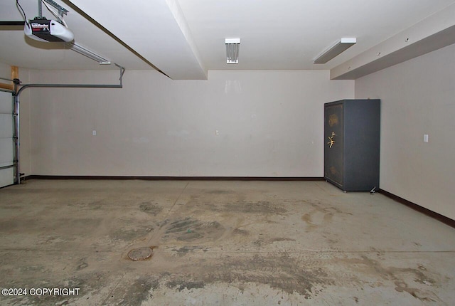 928 Quiet Creek Dr, Homer, AK 99603 - garage featuring a garage door opener and baseboards