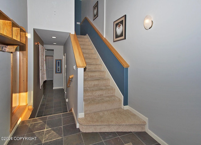 stairs with tile patterned flooring