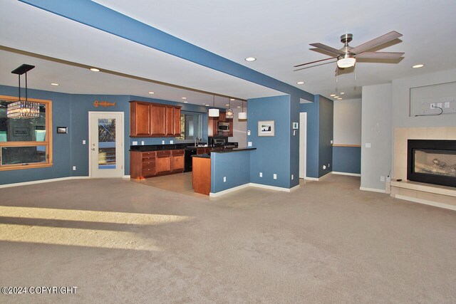 interior space featuring ceiling fan, decorative light fixtures, carpet floors, and black dishwasher