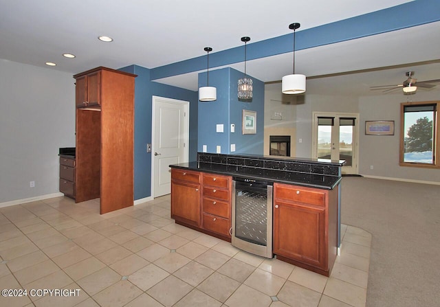 928 Quiet Creek Dr, Homer, AK 99603 - kitchen featuring beverage cooler, open floor plan, baseboards, recessed lighting, and hanging light fixtures