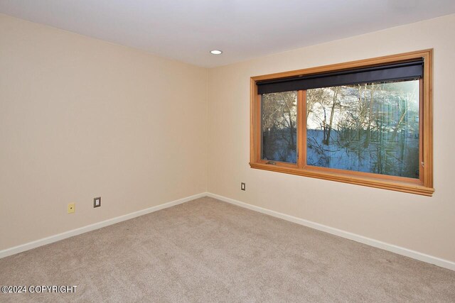 928 Quiet Creek Dr, Homer, AK 99603 - carpeted empty room featuring baseboards and recessed lighting