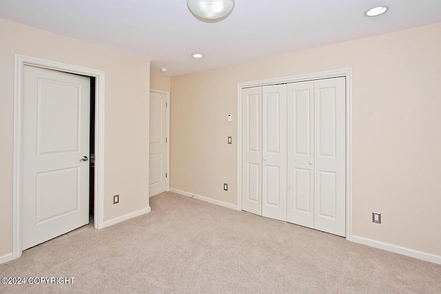 928 Quiet Creek Dr, Homer, AK 99603 - unfurnished bedroom with light carpet, baseboards, recessed lighting, and a closet