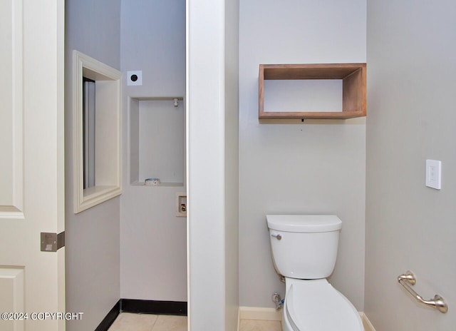 bathroom featuring toilet and tile patterned floors