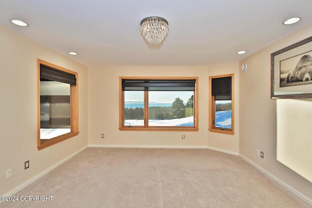 928 Quiet Creek Dr, Homer, AK 99603 - empty room with light colored carpet, recessed lighting, a chandelier, and baseboards