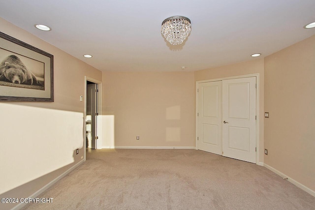 928 Quiet Creek Dr, Homer, AK 99603 - carpeted empty room featuring recessed lighting, a chandelier, and baseboards
