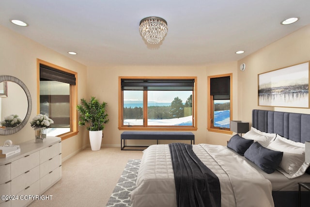 bedroom featuring light colored carpet