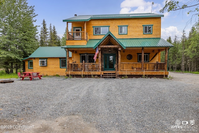 cabin featuring a porch