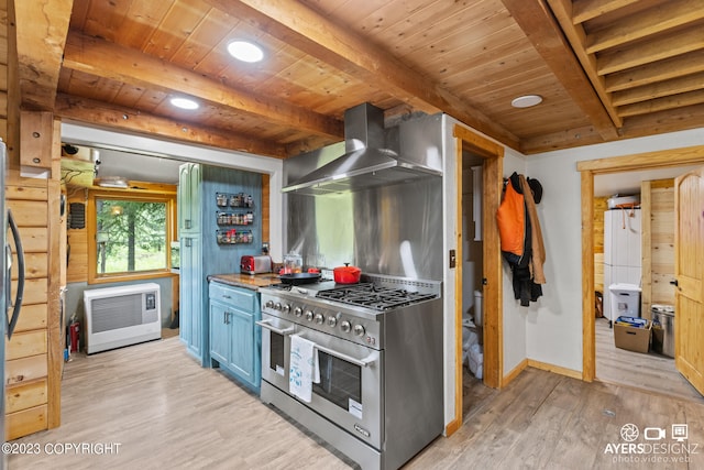 kitchen with appliances with stainless steel finishes, beamed ceiling, light wood-type flooring, wall chimney range hood, and wood ceiling