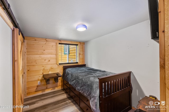 bedroom with hardwood / wood-style floors