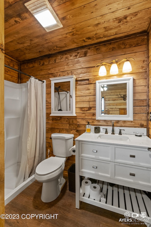 bathroom with wood-type flooring, wooden ceiling, toilet, wooden walls, and oversized vanity