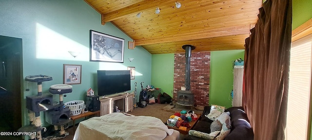 9450 Keshon Cir, Wasilla, AK 99654 - living area featuring wooden ceiling, a wood stove, and carpet floors