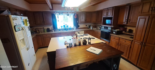 9450 Keshon Cir, Wasilla, AK 99654 - kitchen with white appliances, a sink, a kitchen island, and brown cabinetry