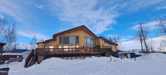 9450 Keshon Cir, Wasilla, AK 99654 - snow covered property featuring stairway and a wooden deck