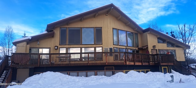 9450 Keshon Cir, Wasilla, AK 99654 - snow covered house with stairs and a wooden deck