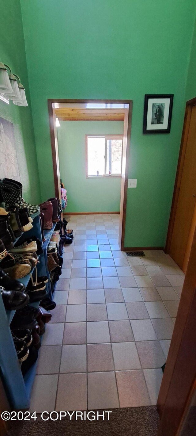 9450 Keshon Cir, Wasilla, AK 99654 - interior space featuring light tile patterned floors and a high ceiling