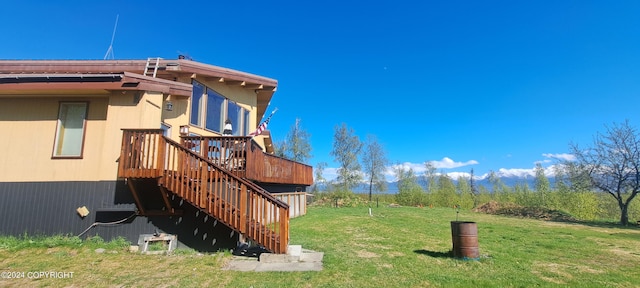 9450 Keshon Cir, Wasilla, AK 99654 - view of property exterior featuring a yard, stairs, and a wooden deck