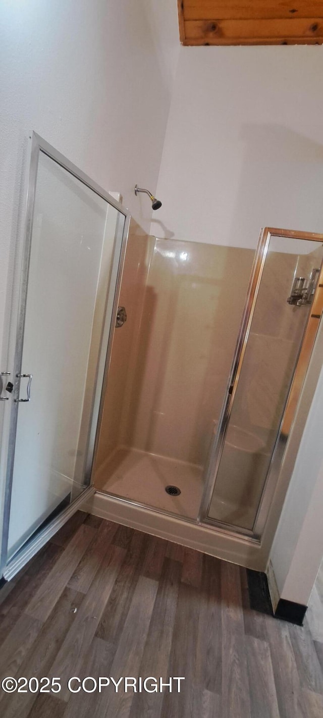 9450 Keshon Cir, Wasilla, AK 99654 - full bathroom featuring a stall shower and wood finished floors