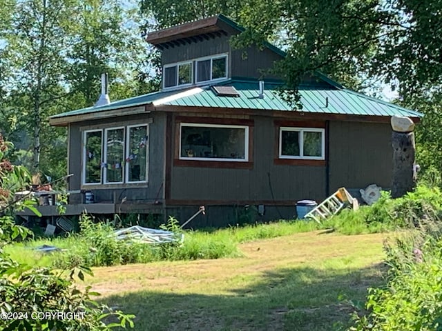 view of property exterior featuring a yard