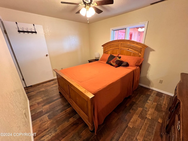 bedroom with ceiling fan and dark hardwood / wood-style flooring