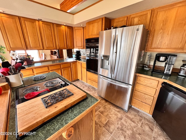 kitchen with appliances with stainless steel finishes and light tile patterned floors