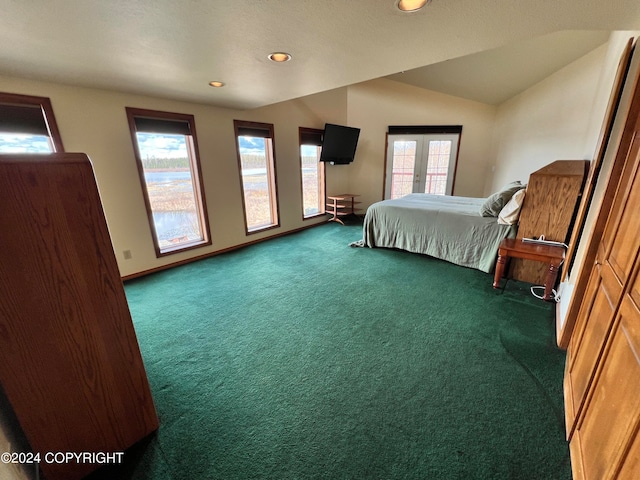 carpeted bedroom featuring vaulted ceiling