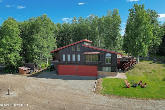 exterior space featuring a garage and a front yard