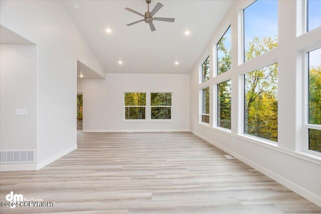 interior space with vaulted ceiling and ceiling fan