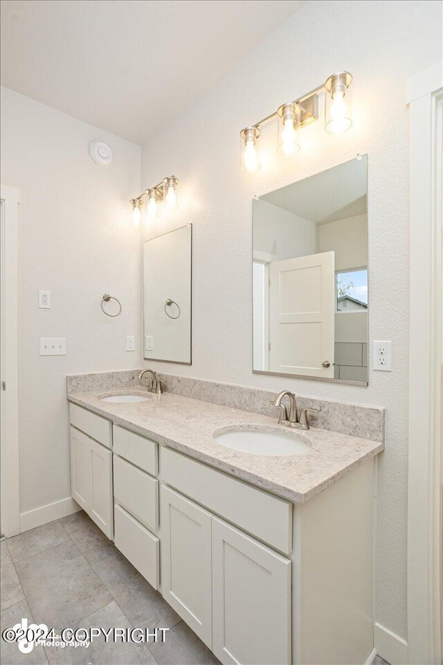 bathroom featuring vanity and tile patterned flooring