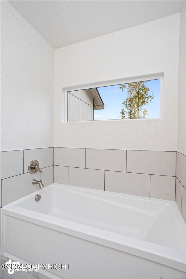 bathroom featuring a tub