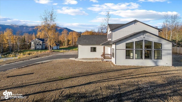 view of home's exterior with a mountain view