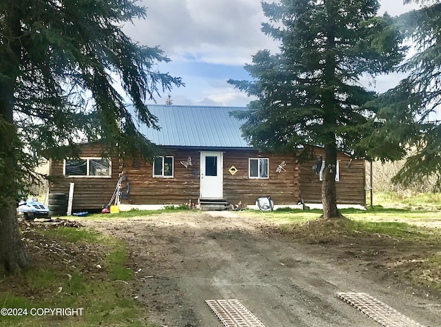 view of log cabin