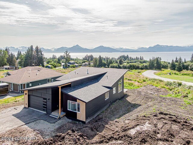 birds eye view of property featuring a mountain view