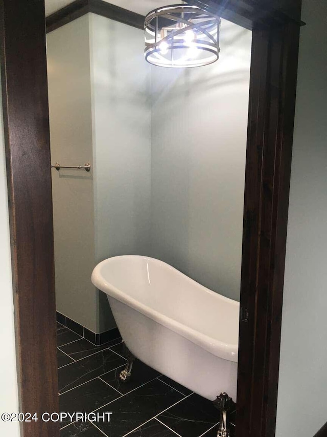 bathroom featuring tile patterned floors and a bathing tub