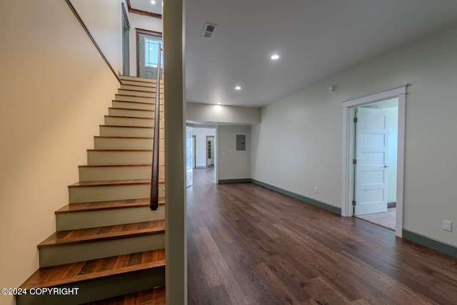 staircase with wood-type flooring