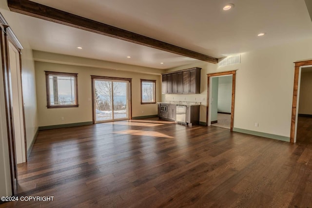 unfurnished living room featuring beamed ceiling and dark hardwood / wood-style floors