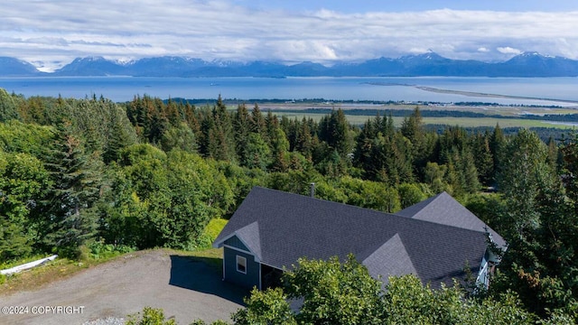 bird's eye view with a water and mountain view