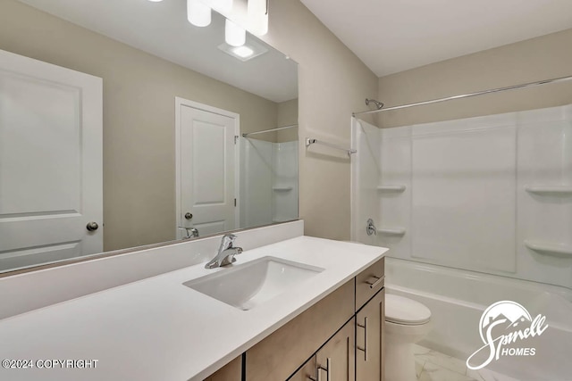 full bathroom with tile floors, toilet, washtub / shower combination, and vanity with extensive cabinet space