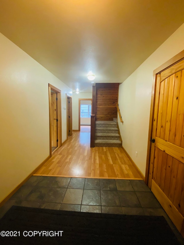 hallway with wood-type flooring