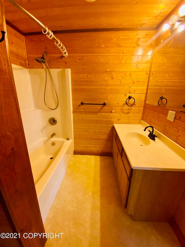 bathroom featuring shower / tub combination, wooden ceiling, wooden walls, and vanity