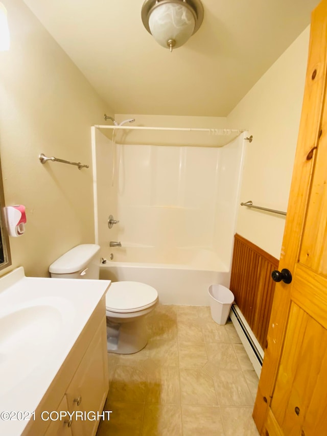 full bathroom featuring a baseboard radiator, tile flooring, shower / washtub combination, vanity, and toilet