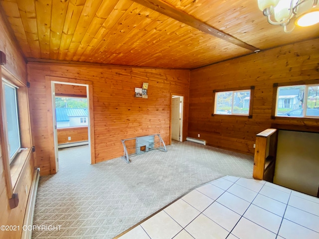 unfurnished bedroom with a baseboard heating unit, an inviting chandelier, wooden ceiling, wood walls, and light colored carpet