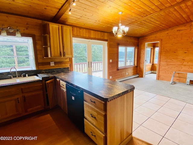 kitchen featuring vaulted ceiling, wooden walls, and wood ceiling