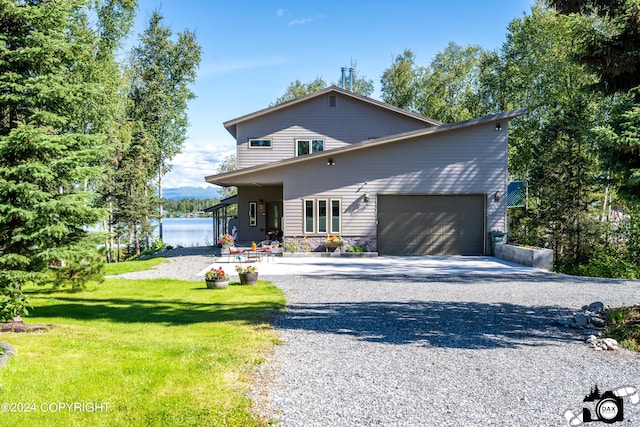 view of front property with a front lawn and a garage