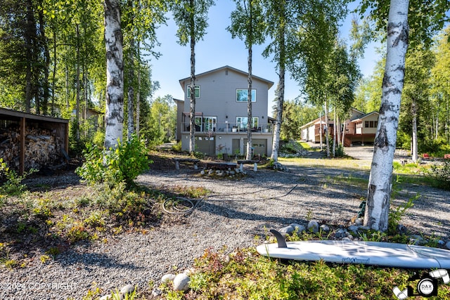 back of property featuring a balcony