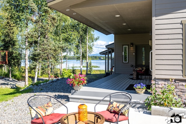 view of patio featuring a water view